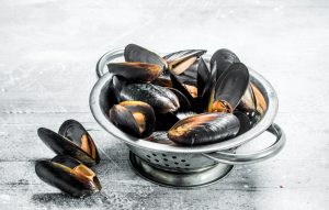 Fresh seafood clams in a saucepan.