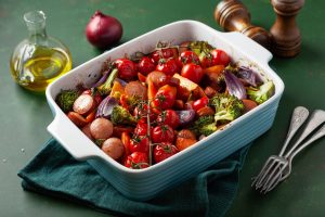 oven baked vegetables and sausages, healthy lunch, sweet potato onion tomato broccoli